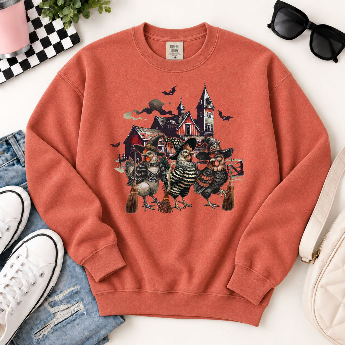 Rust-orange Halloween sweatshirt with witchy chicken graphic, crewneck and cuffs