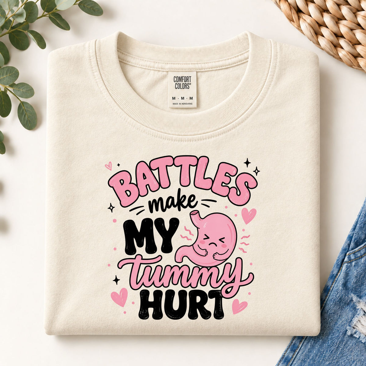 Ivory sweatshirt with colorful 'Battles make my tummy hurt' belly graphic