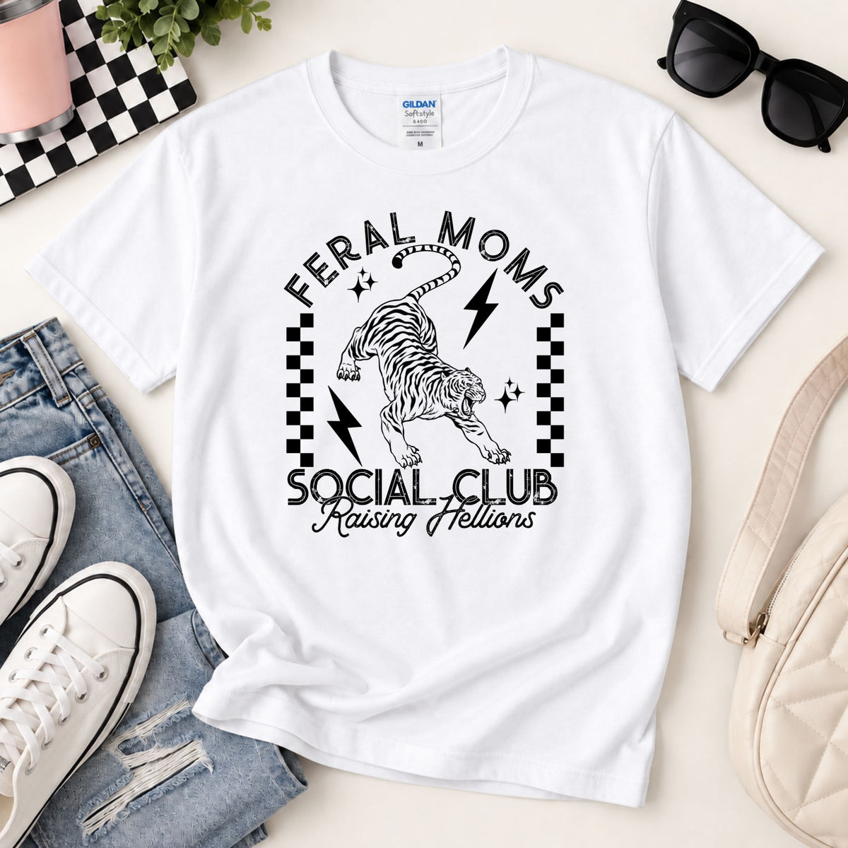 White graphic tee with black zebra lightning and checkered frame around 'Social Club'