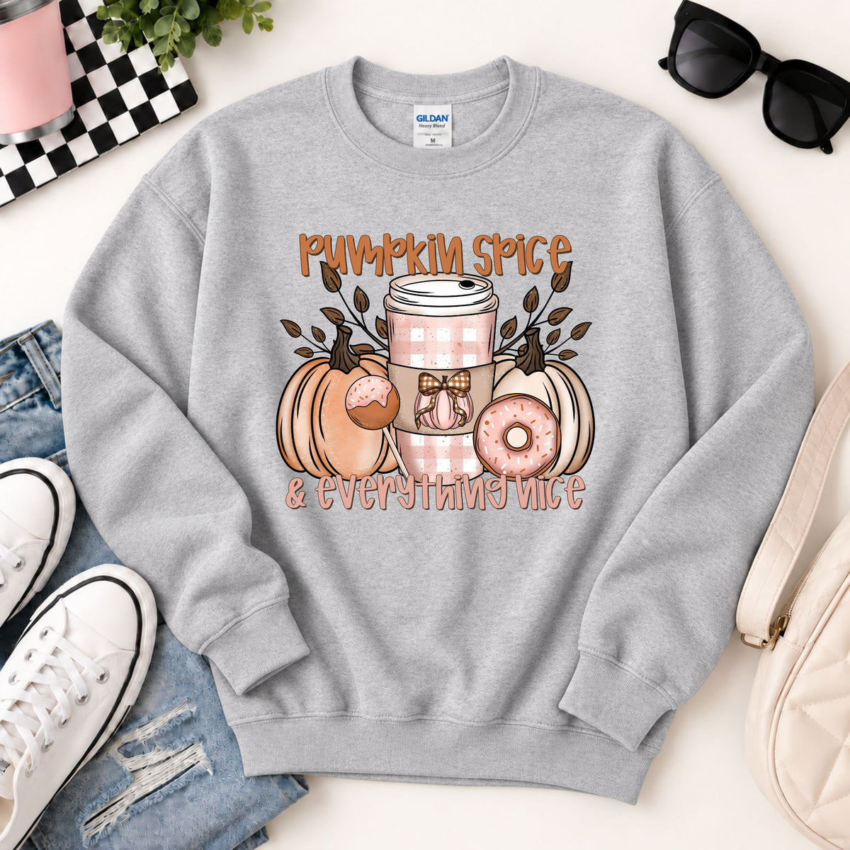 Light gray crewneck sweatshirt with pumpkin spice and everything nice graphic, full front