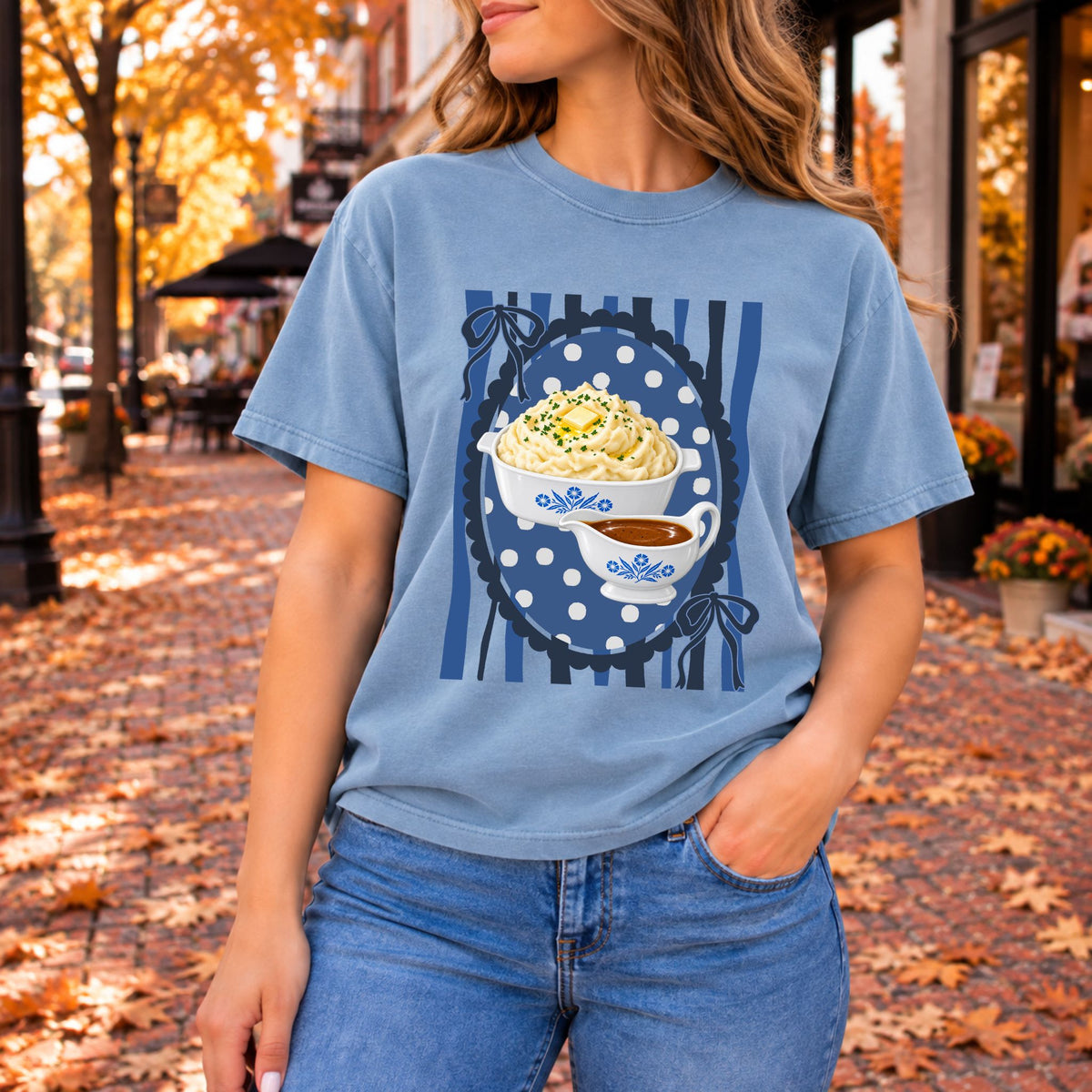 Light blue graphic tee printed with mashed potatoes, butter, chives, and a gravy boat