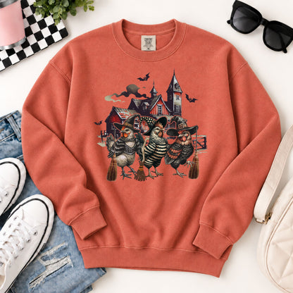 Rust-orange Halloween sweatshirt with witchy chicken graphic, crewneck and cuffs