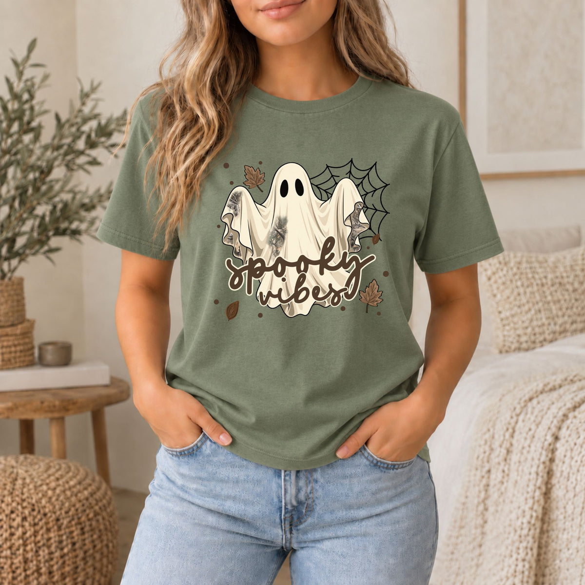 Olive green ghost Halloween graphic tee with white ghost trio and “spooky vibes” lettering