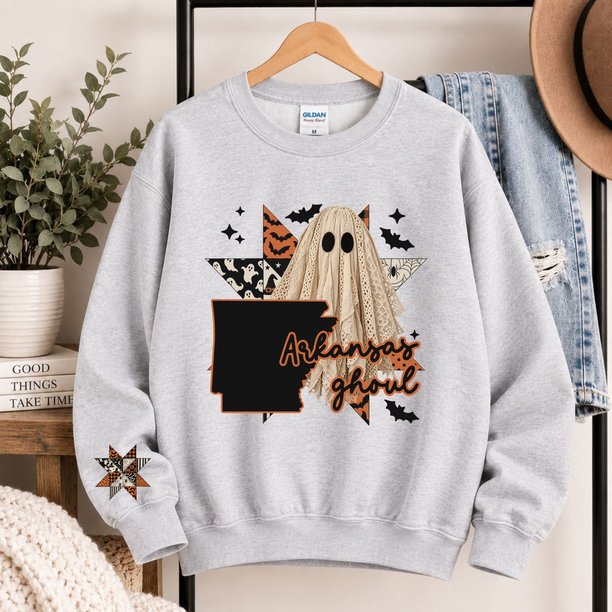 Light gray crewneck sweatshirt with Arkansas ghoul graphic and state silhouette