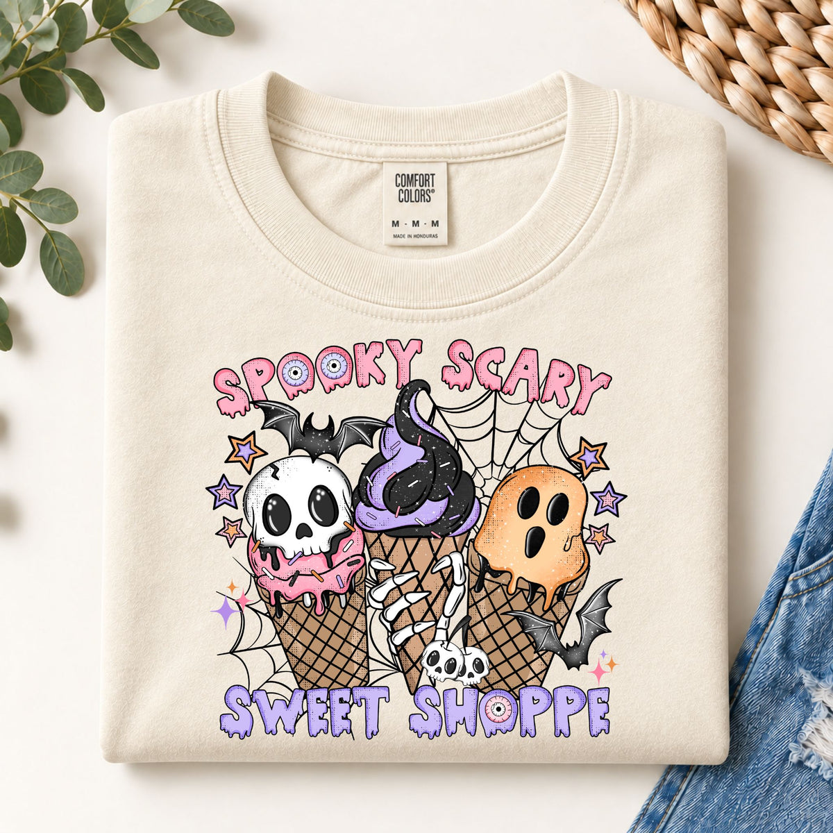 Cream crewneck sweatshirt with large front print of skulls and ice-cream cones
