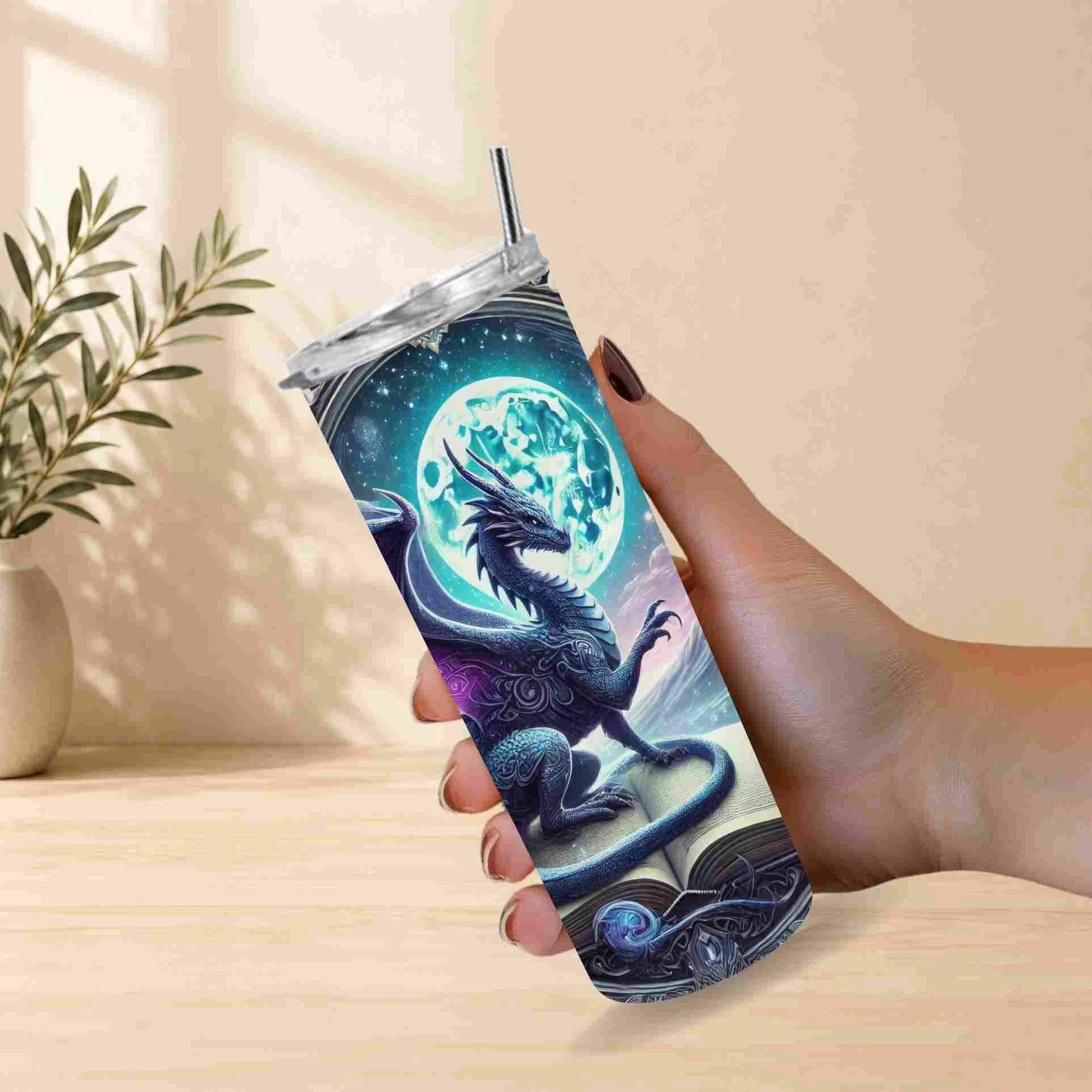 Tumbler with dragon design held by a hand on a light wooden surface.