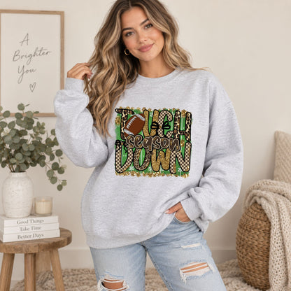 Light gray women’s crewneck sweatshirt with “Touchdown Season” leopard camo football print.