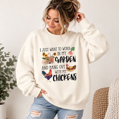Cream crewneck sweatshirt with 'Garden' and chicken graphic worn by woman, long sleeves.