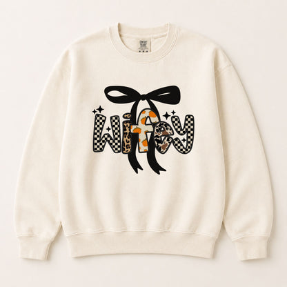 Cream crewneck sweatshirt with black bow and bold fall letter graphic in checkered and spotted.