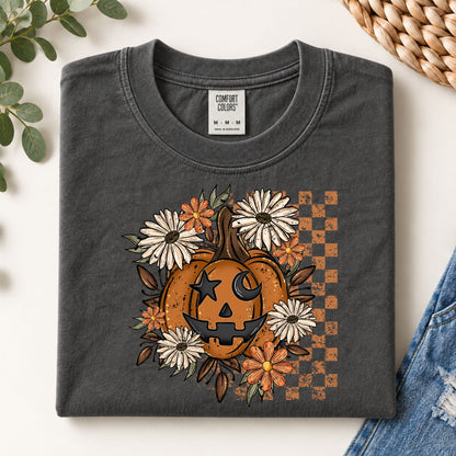 Dark gray Halloween T-shirt with orange jack-o'-lantern and floral wreath graphic