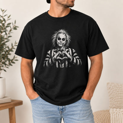 Black graphic T-shirt featuring a black-and-white spooky character with heart hands