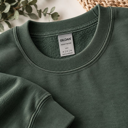 Green crewneck sweatshirt neckline with size label tag inside collar