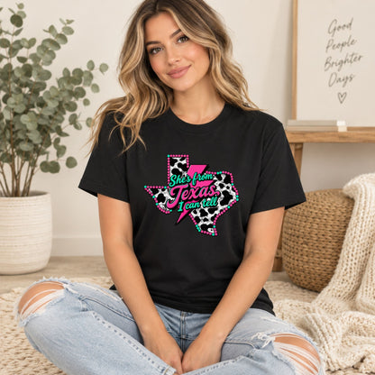 Black graphic T-shirt featuring “She’s from Texas I can tell” in pink over Texas map