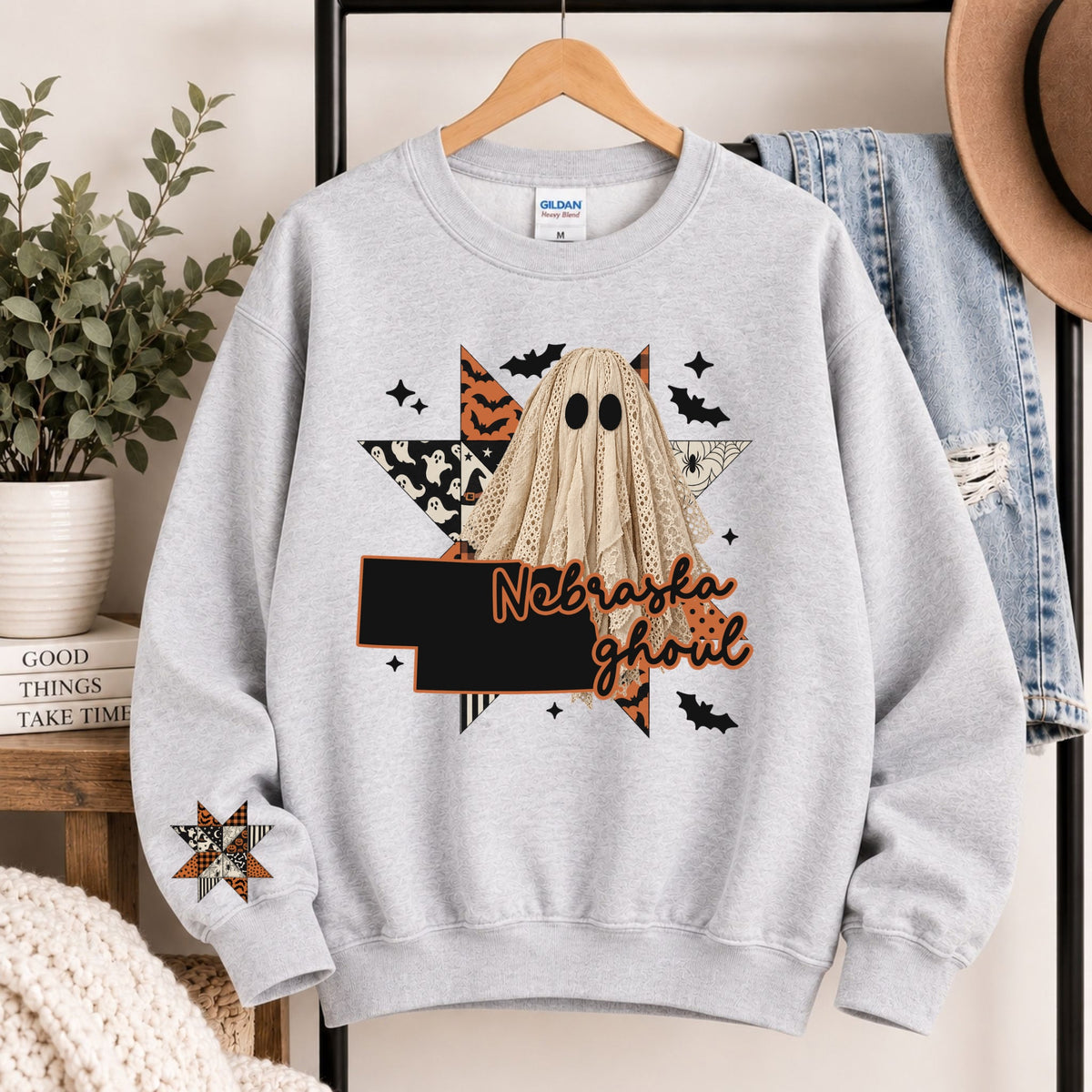 Light gray crewneck sweatshirt with Nebraska ghoul state graphic and burlap ghost hood