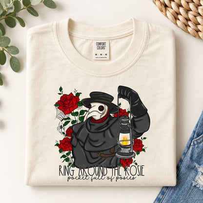 Cream graphic tee with plague doctor holding lantern and red rose print
