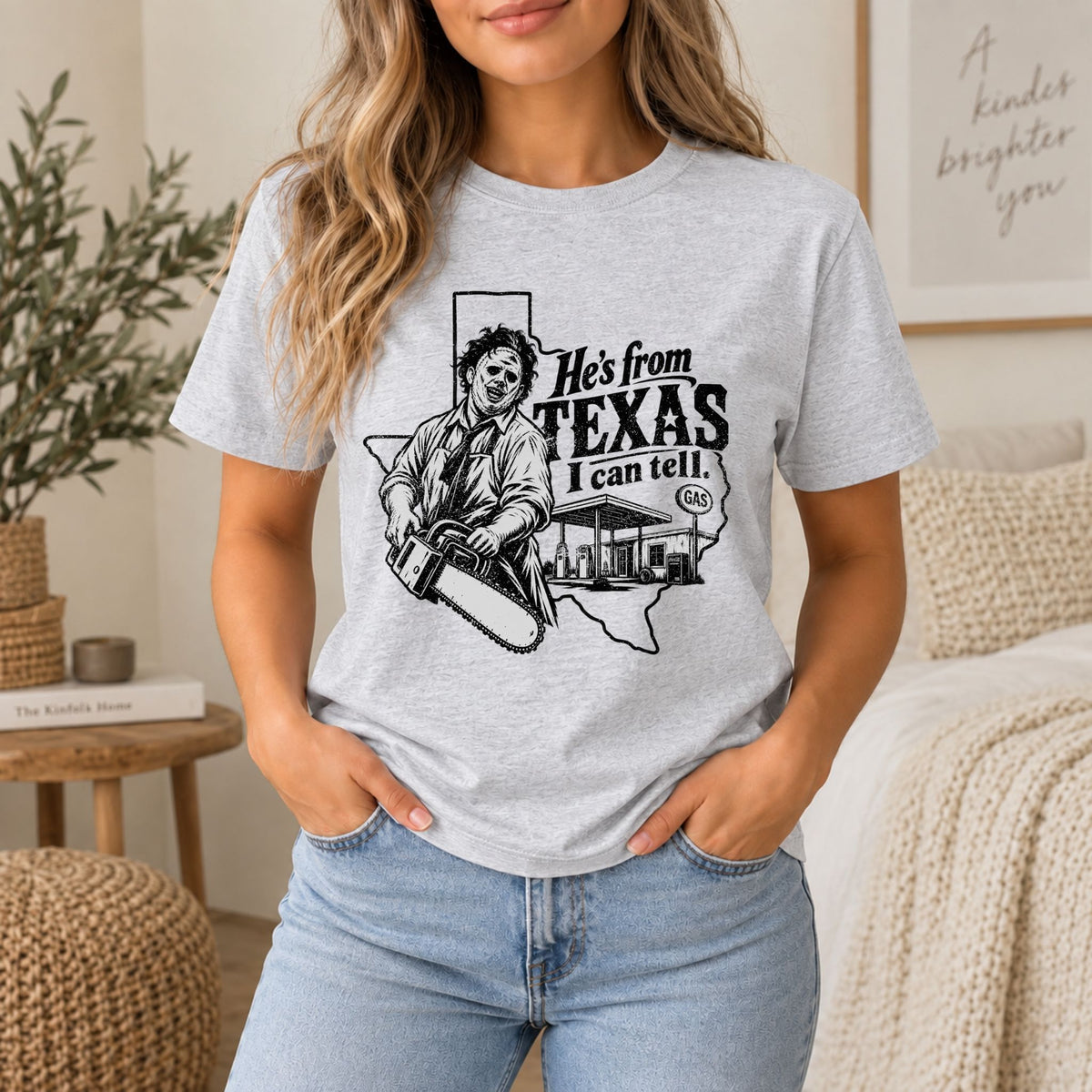 Heather gray horror graphic tee with chainsaw character and Texas text on front