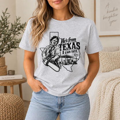 Heather gray horror graphic tee with chainsaw character and Texas text on front