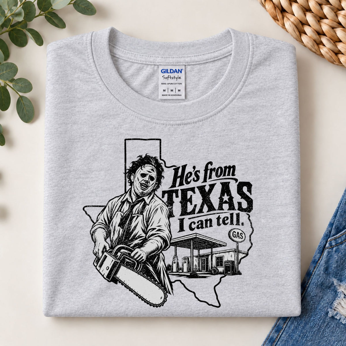 Heather gray horror graphic T-shirt featuring chainsaw character and Texas slogan