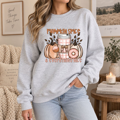 Light gray crewneck sweatshirt with pumpkin spice and everything nice front print