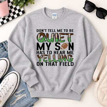 Grey crewneck sweatshirt flat lay with "QUIET" football graphic and "MY SON" lettering