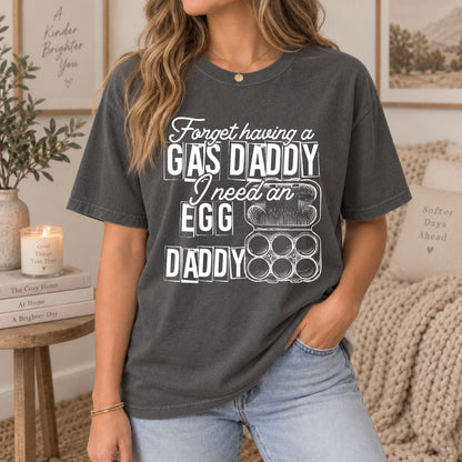 Dark gray graphic tee on model; white GAS DADDY egg and daddy artwork