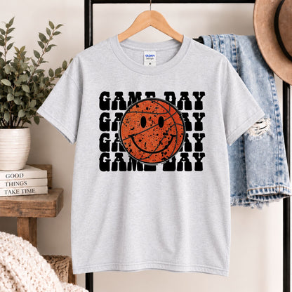 Heather gray T-shirt on hanger with orange basketball smiley face and black GAME DAY graphic