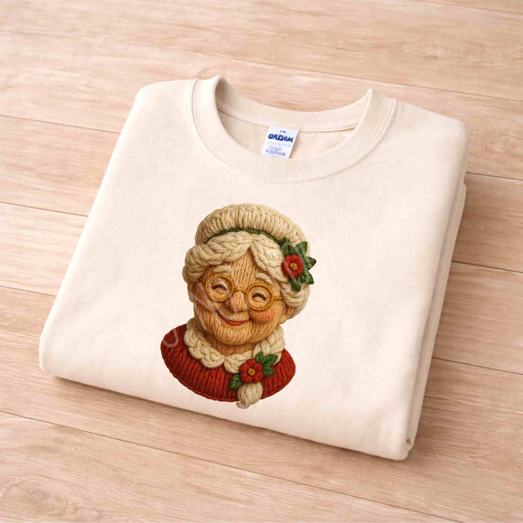Vintage Mrs. Claus sweatshirt featuring a cozy knit-style graphic of Mrs. Claus, perfect for the holiday season.