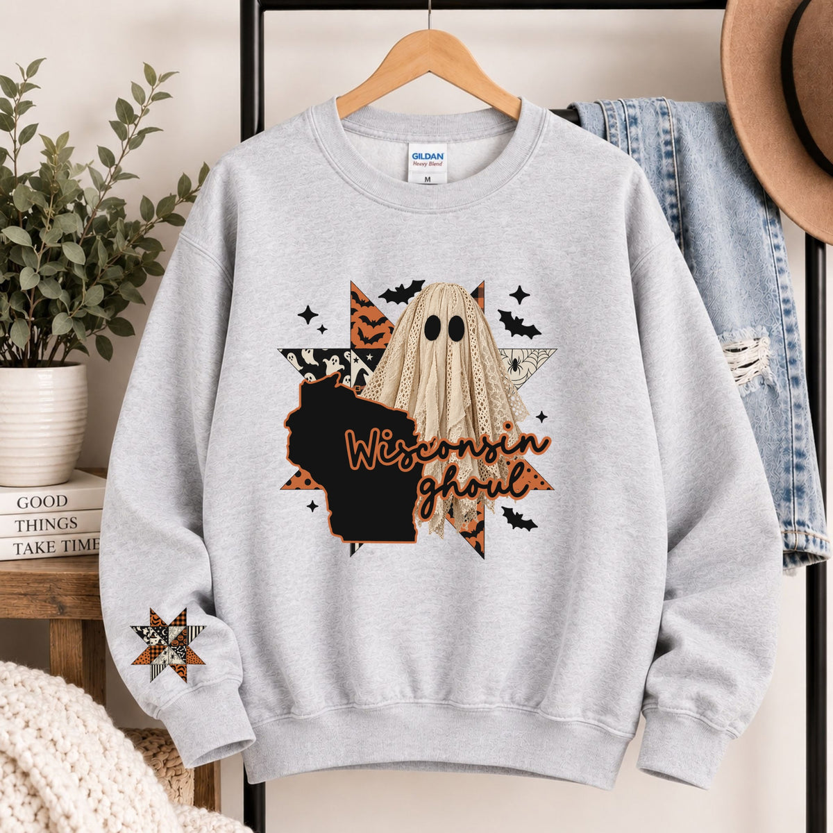Light gray crewneck sweatshirt with Wisconsin ghoul graphic and state silhouette