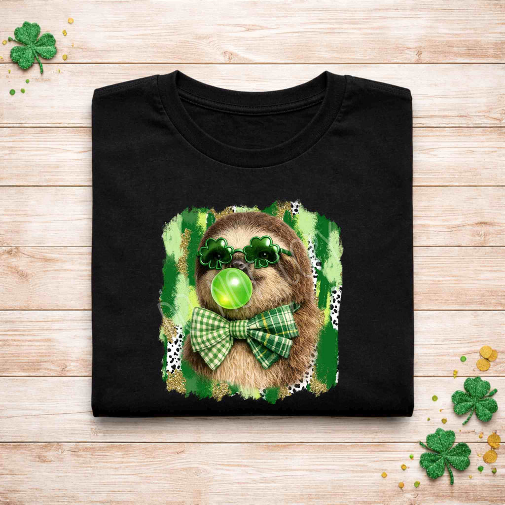 St. Patricks Day sloth shirt featuring a sloth with shamrock glasses and a green gingham bow on a festive background.