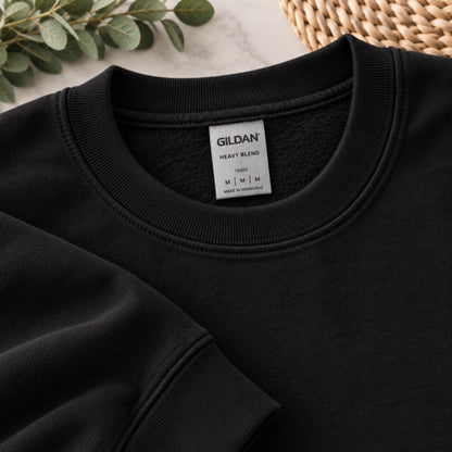 Black crewneck sweatshirt neckline detail with GILDAN size label