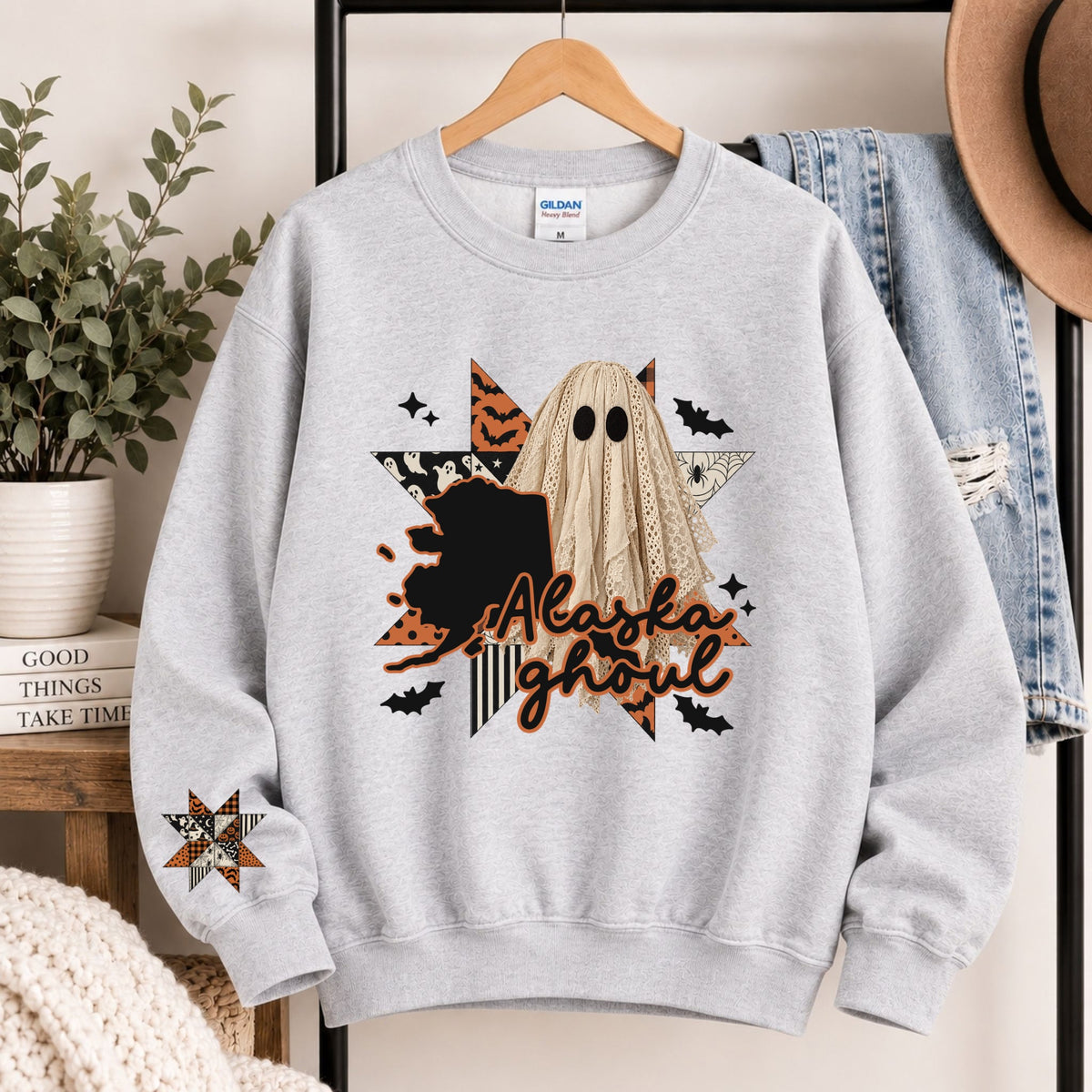 Light gray crewneck sweatshirt with Alaska state ghost Halloween graphic