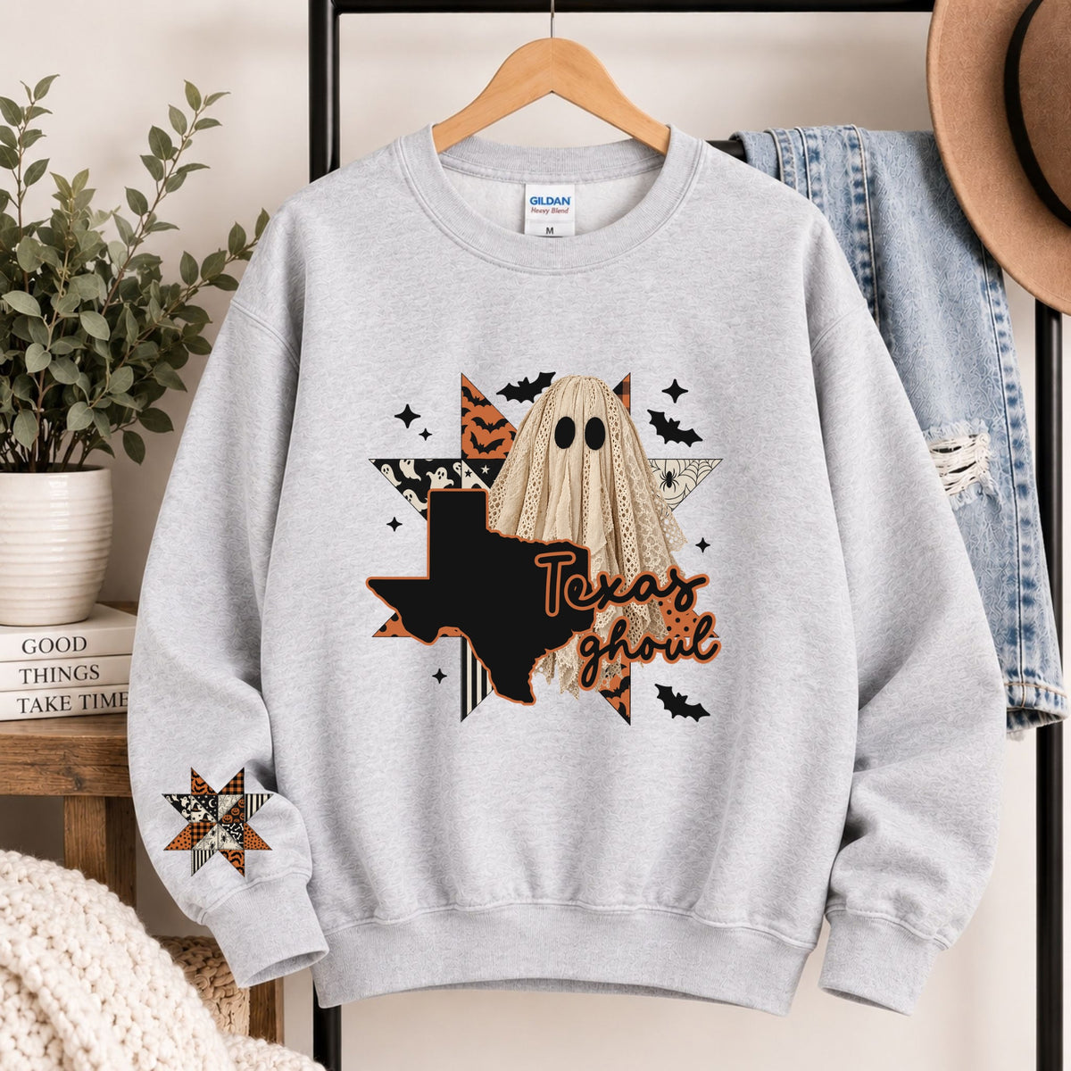 Light gray crewneck sweatshirt with Texas ghoul graphic and state silhouette
