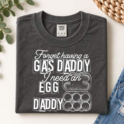 Dark gray graphic tee with white GAS DADDY and egg-themed illustration on front