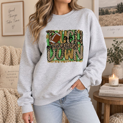 Light gray sweatshirt with “Touchdown Season” leopard camo football graphic, long sleeves.