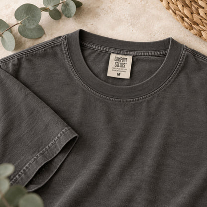 Dark gray T-shirt neckline detail with comfort colors label