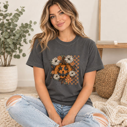 Dark gray Halloween T-shirt worn with orange jack-o'-lantern floral square graphic