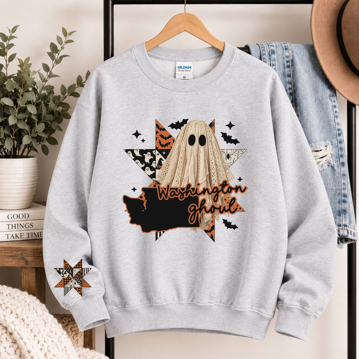 Light gray crewneck sweatshirt with Washington ghoul graphic and state silhouette