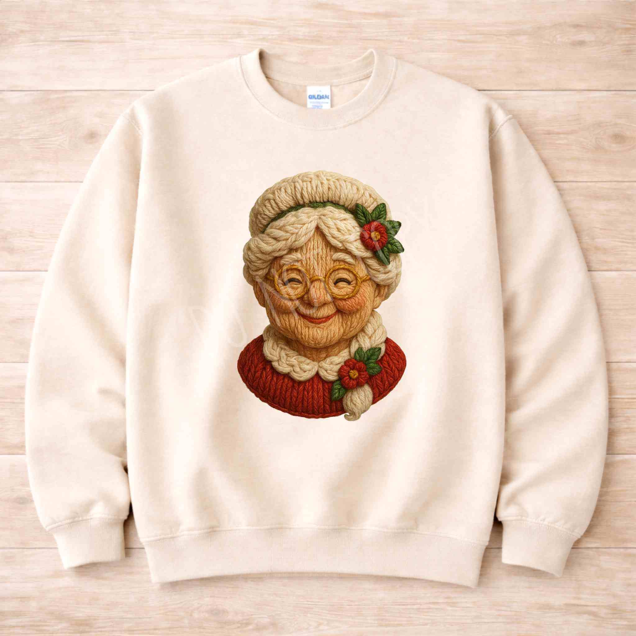 Vintage Mrs. Claus sweatshirt featuring a nostalgic knit-style graphic on a cozy cream background.