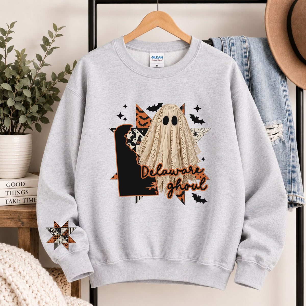 Light gray crewneck sweatshirt with Delaware state ghost Halloween graphic