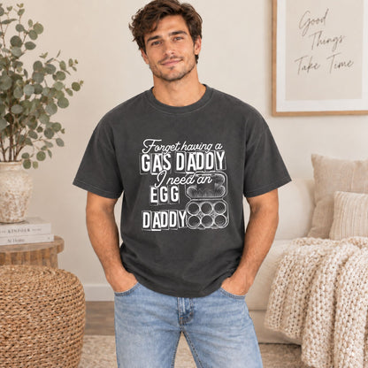 Dark gray graphic tee on male model; white GAS DADDY egg and daddy grid print
