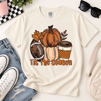 Cream flat-lay fall graphic tee with pumpkin cluster and “Tis the Season” print