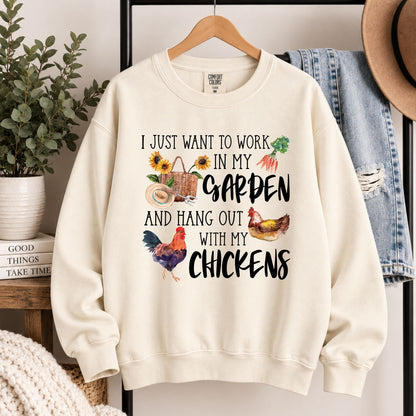 Cream sweatshirt on hanger with garden and chicken typography graphic, crewneck.