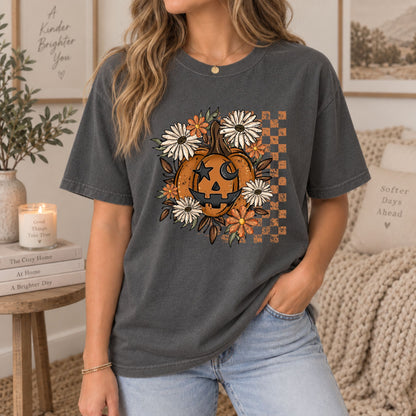 Dark gray Halloween T-shirt worn with jack-o'-lantern face and orange floral wreath print