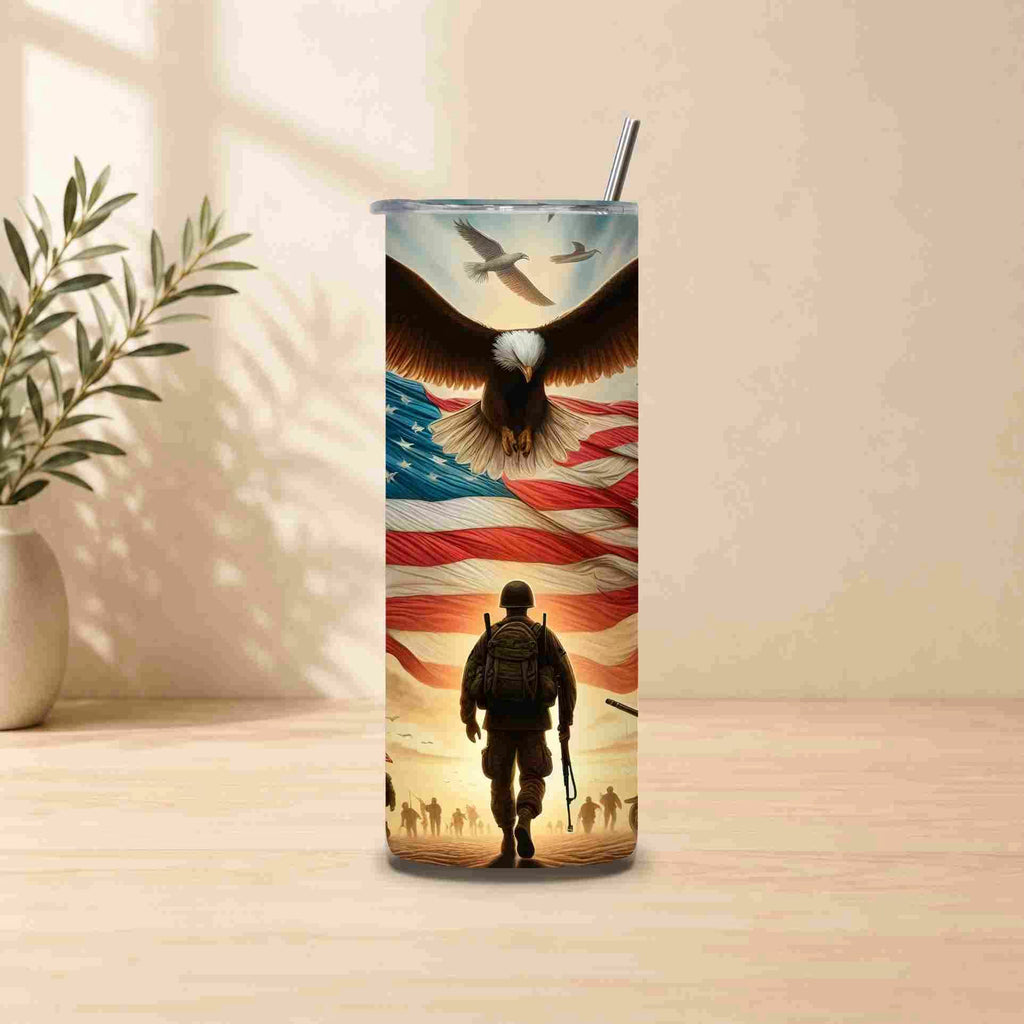 Tumbler with an eagle and American flag design on a wooden surface.