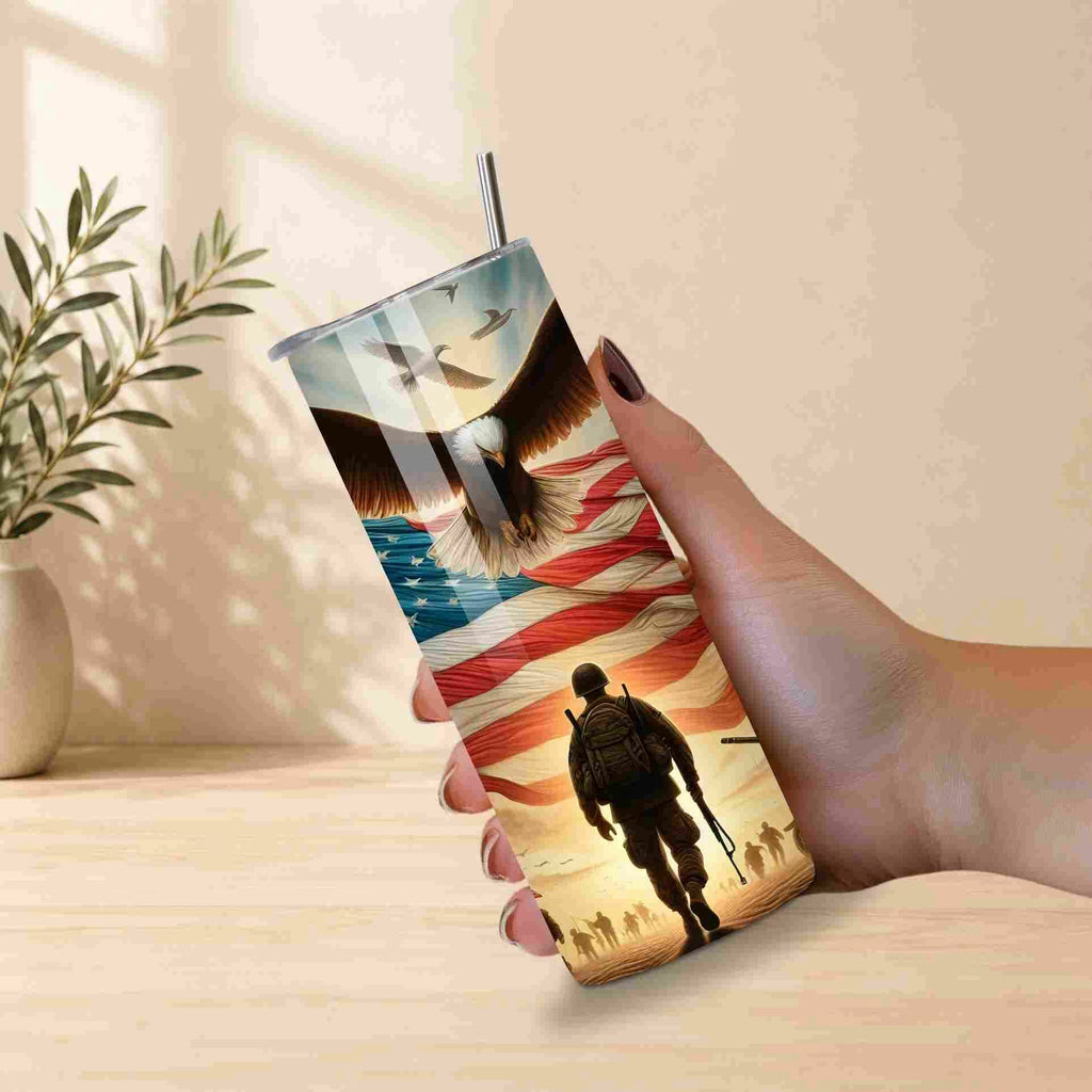 Tumbler with a design of a soldier, eagle, and American flag held by a hand.