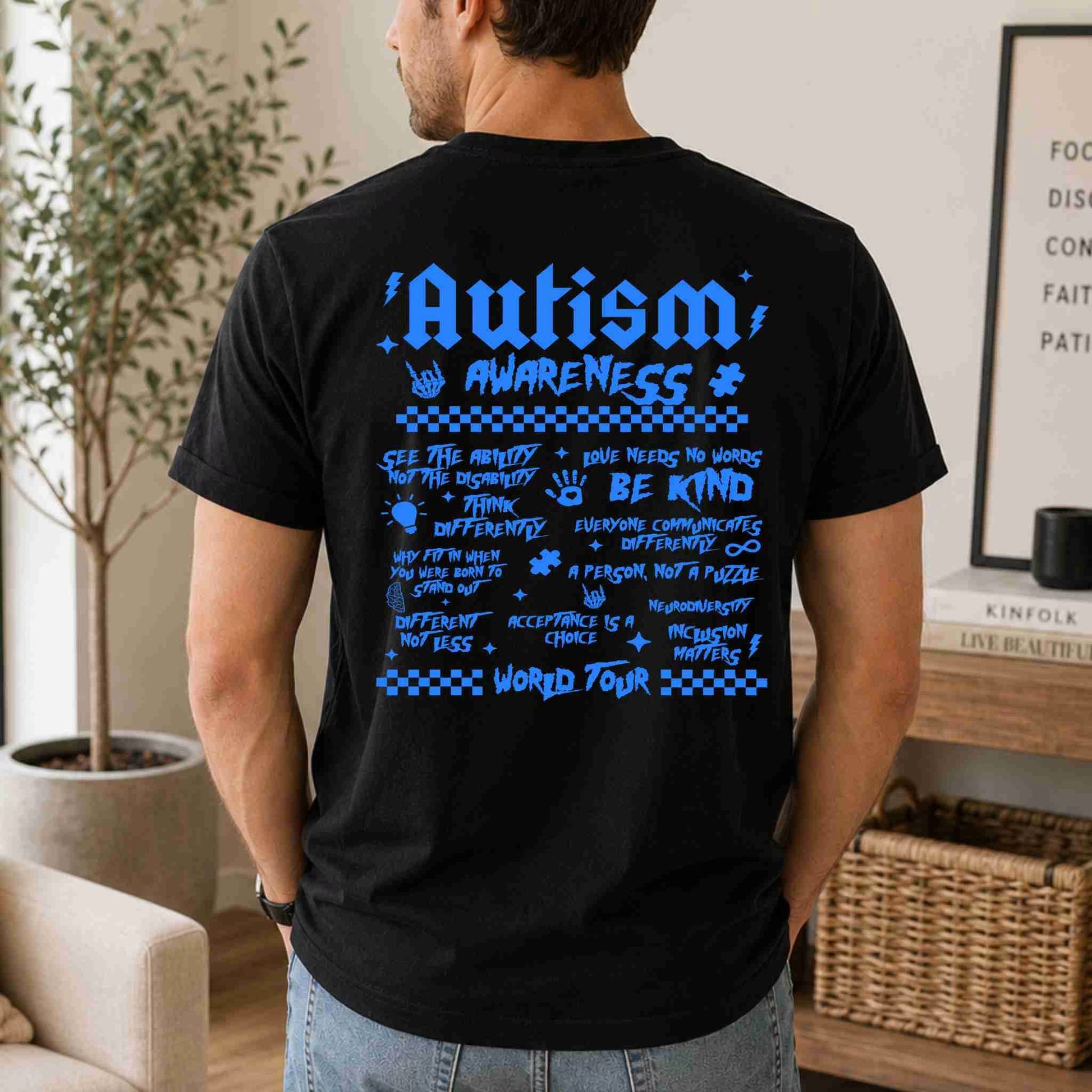 Person wearing a black t-shirt with 'Autism Awareness' text and graphics in blue.
