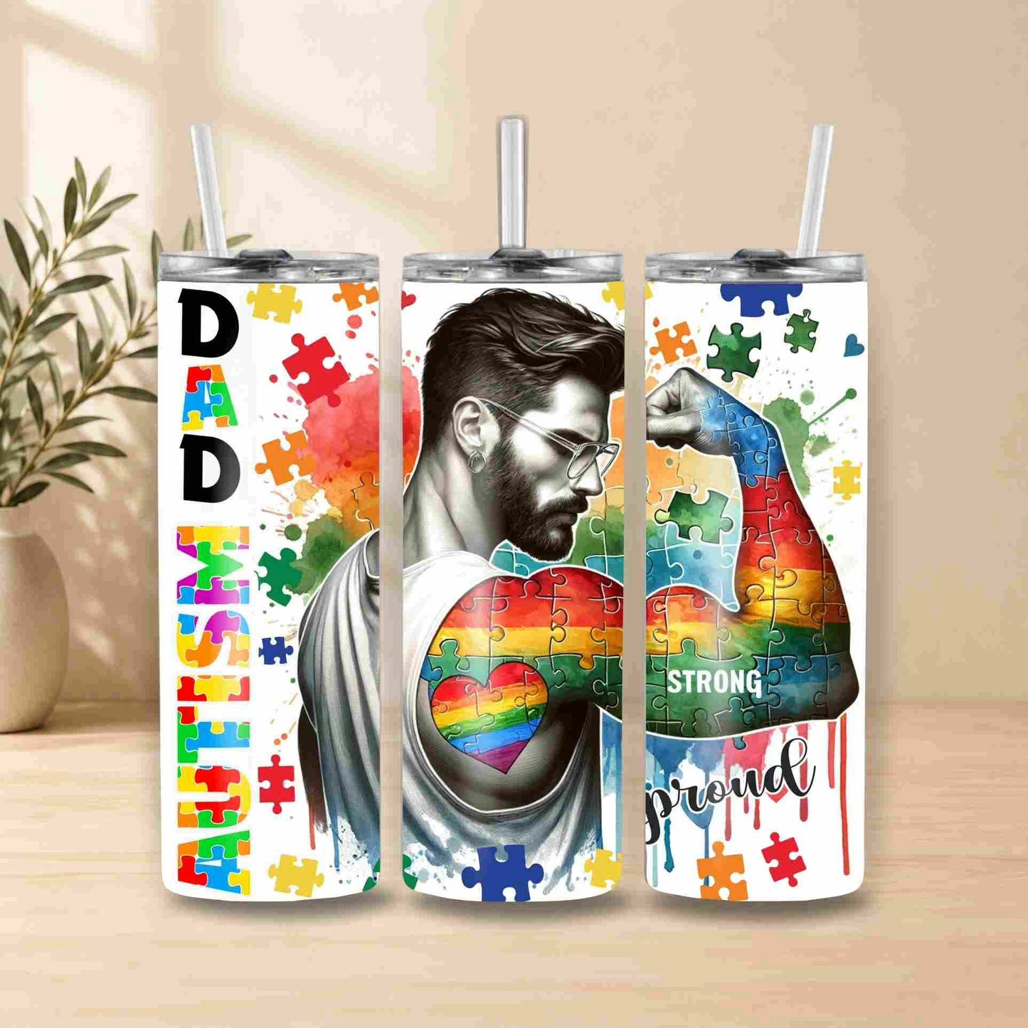 Tumbler with a design of a man, rainbow heart, and puzzle pieces on a white background.