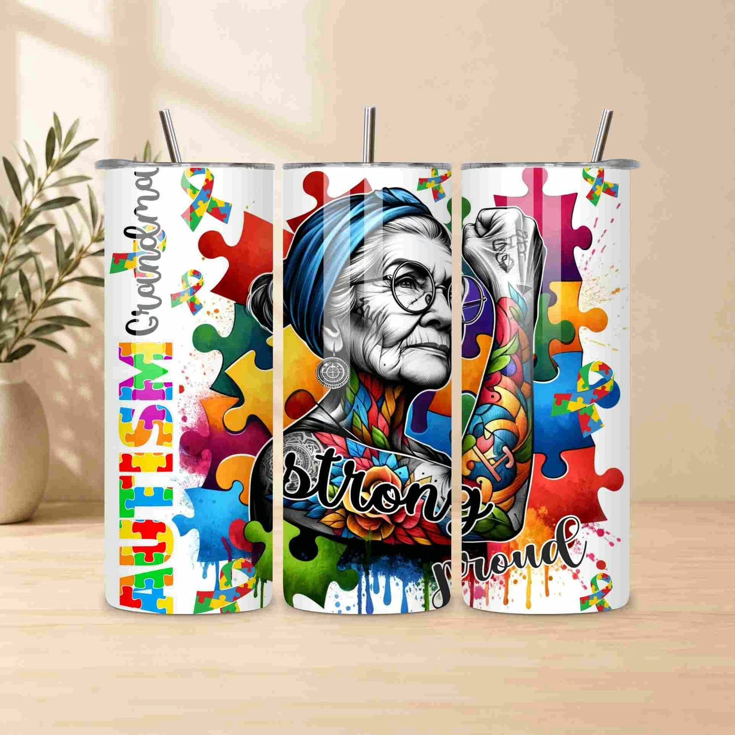 Tumbler with colorful design featuring a person and autism awareness symbols on a wooden surface.