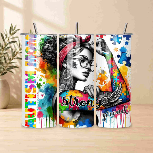 Three colorful tumblers with artistic designs and text on a wooden surface.