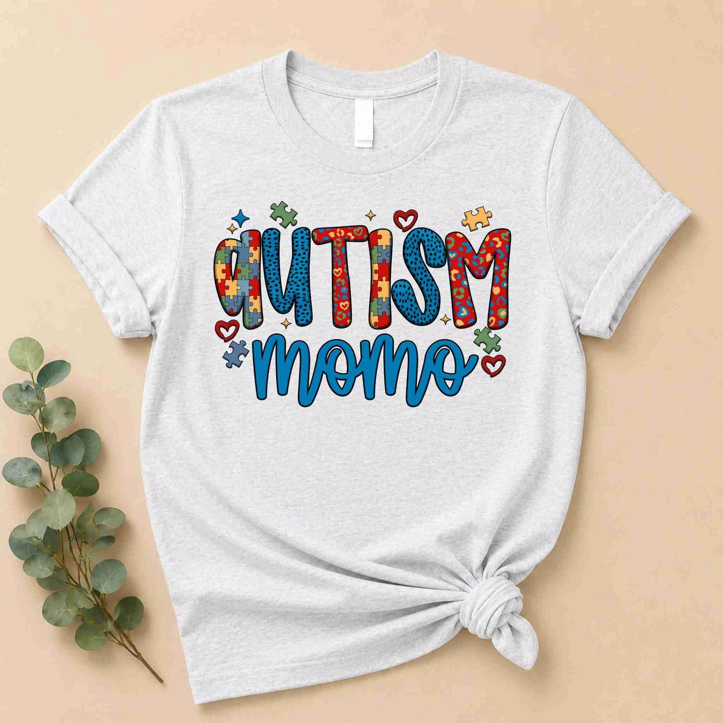 Ash Grey t-shirt with 'Autism Momo' text on a beige background